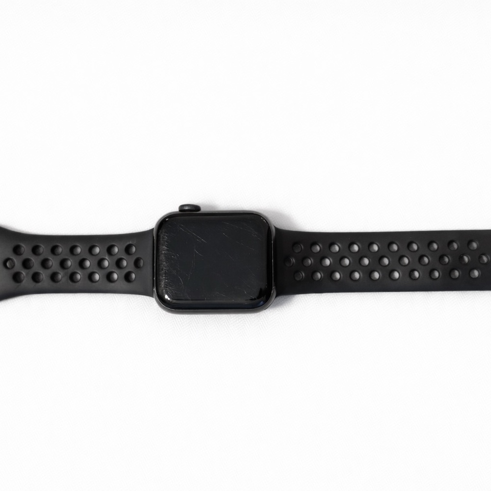 Black Apple Watch with Nike sport band (perforated style).